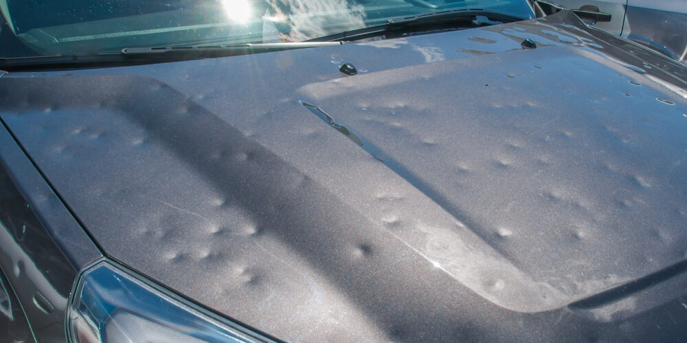 Dented,Car,After,A,Big,Hail,Storm
