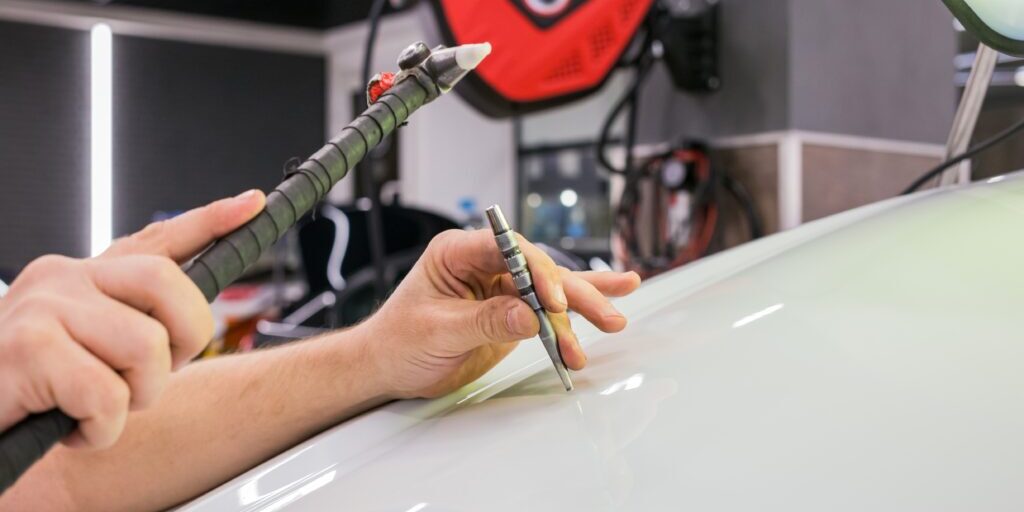 A,Specialist,Repairs,A,Dent,On,The,Car,Body,Without